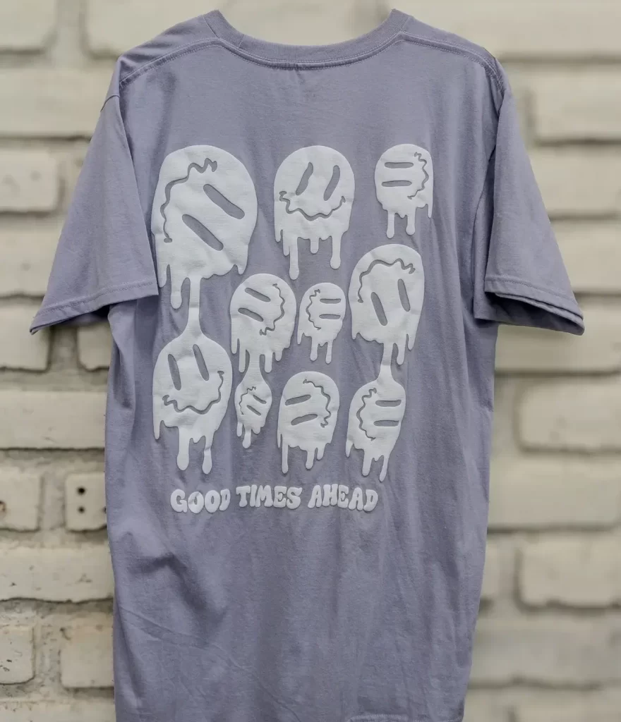 Custom screen printed t-shirt with 'Good Times Ahead' text and melted smiley faces design - Socaprint
